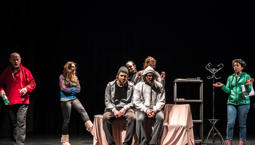 A performance group on stage protected by their performance insurance.