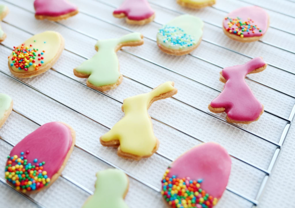 Easter cookies decorated on a baking tray.