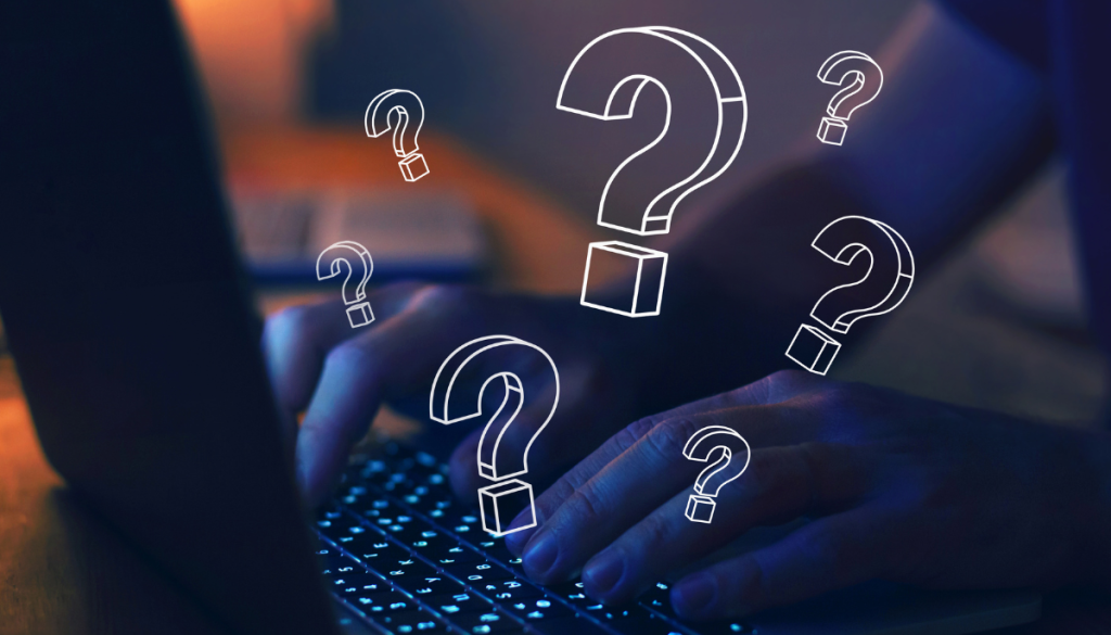 Event insurance FAQs illustrated through typing on a open laptop with question marks surrounding the hands.