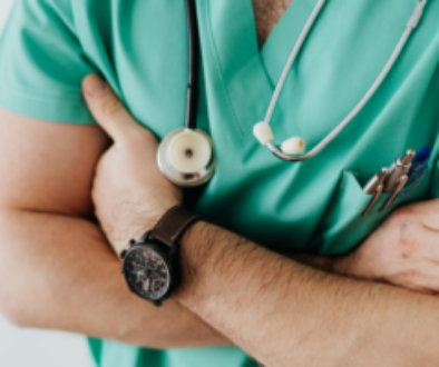 Crop doctor with stethoscope in hospital