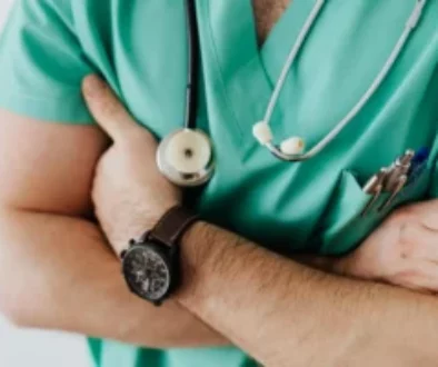 Crop doctor with stethoscope in hospital