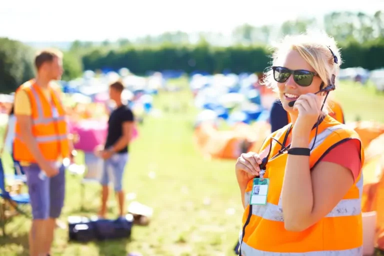 Event staff member in a high-visibility vest, illustrating employers liability insurance for events.