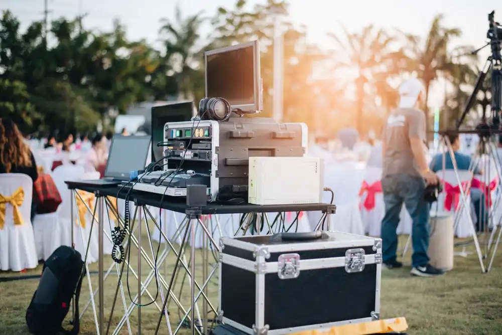 Audio and technical equipment at an outdoor event, representing event equipment insurance.